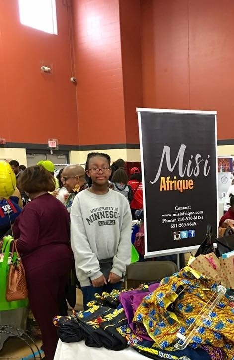 Itunu Helping out with Misi Afrique. 